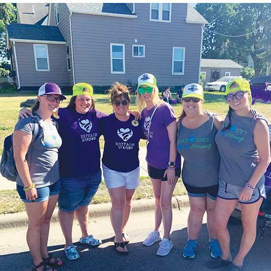 Teri Lachermeier (third from left) pictured with staff members of the Allina Crossroad Clinic at Buffalo Days wearing Buffalo Strong and Allina Strong apparel. (Photo submitted by Teri Lachermeier)