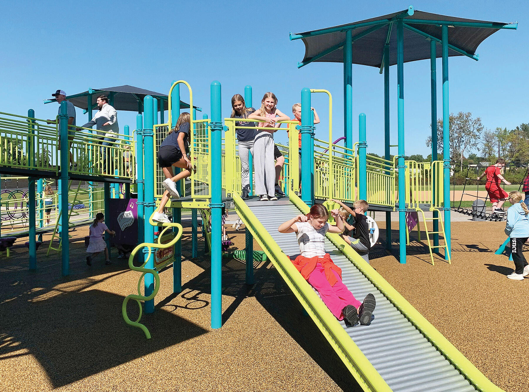 The roller-slide was a hit during the Lions Park playground celebration.