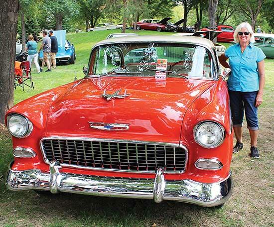 Gloria White, of Buffalo, with Darryl DeMarais’ (her life-long partner) 1955 Chevy Bel Air Coup. Gloria gets the credit for polishing it! (Photo by Shelby Hulstein)