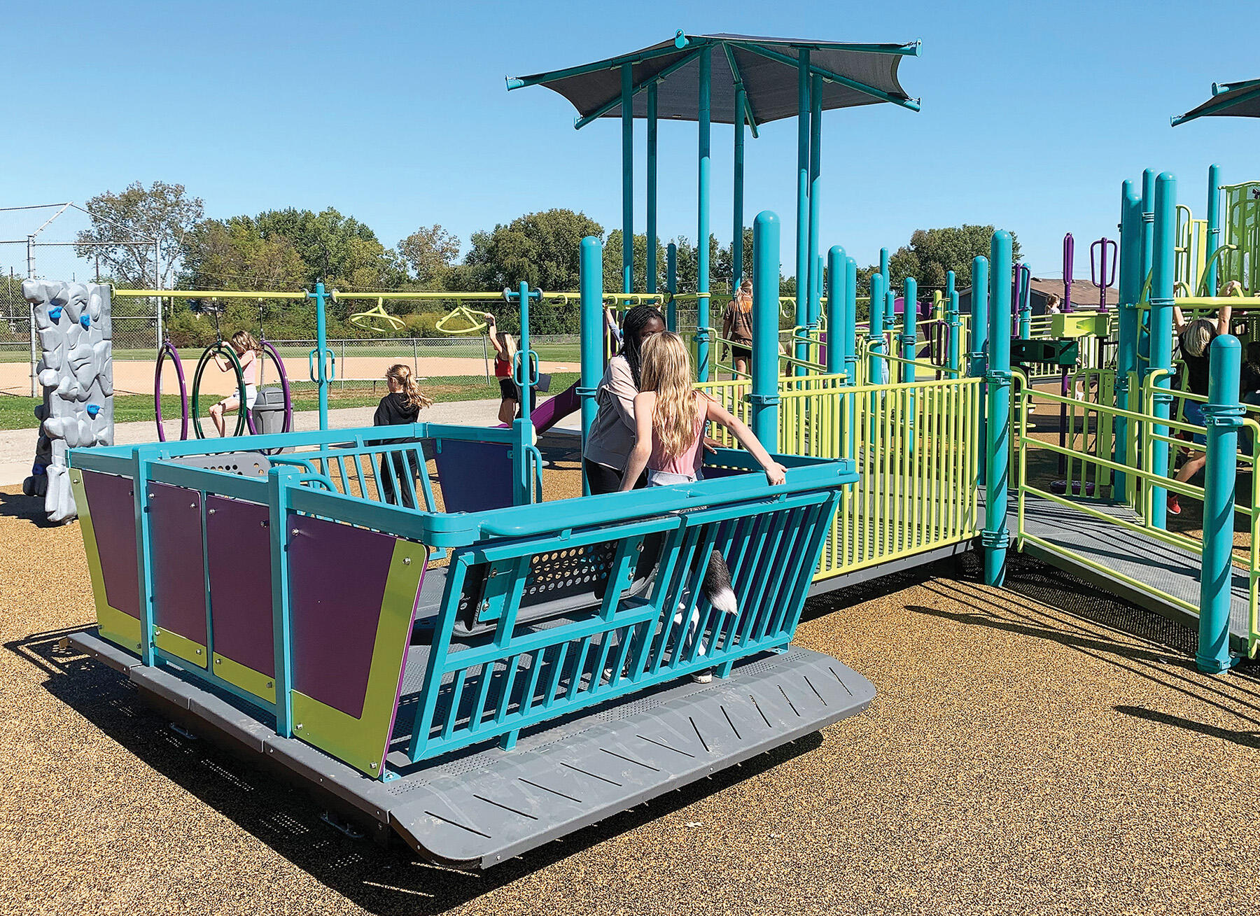 The equipment at the newly renovated Lions Park playground includes a wheelchair accessible glider.