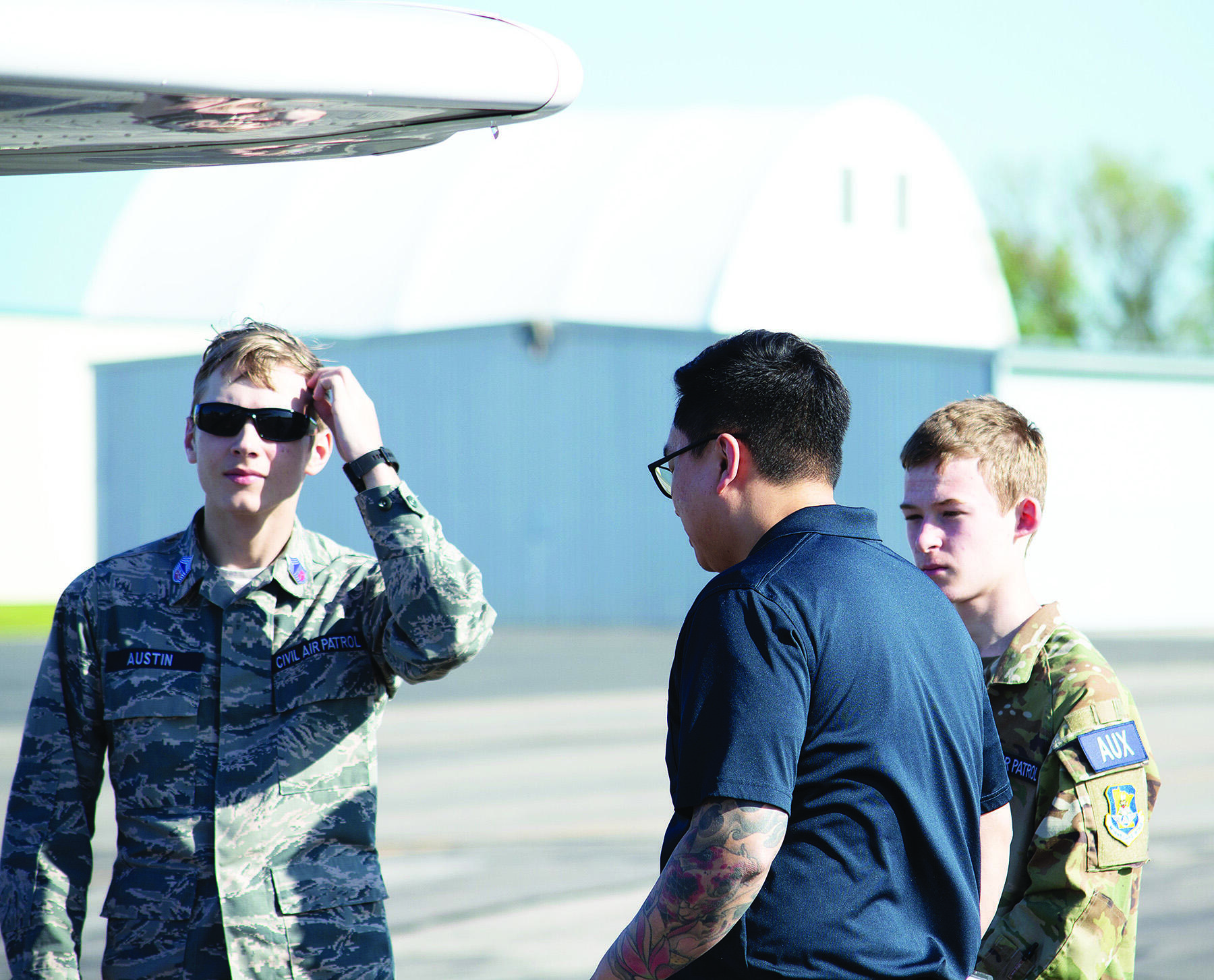 Civil Air Patrol Cadets C/CMSgt Ryatt Austin (left), Captain Cedar Kuoch (middle), and Cadet Joshua Zachman (right) gathered on the runway at Buffalo Municipal Airport this past Memorial Day.