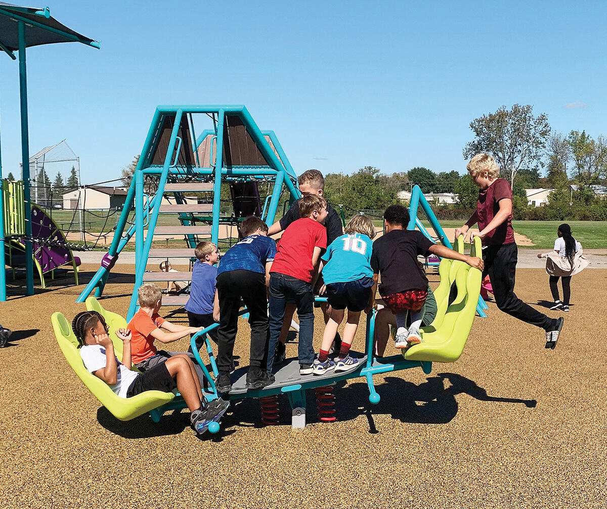 Kids had a blast riding this unique group seesaw.
