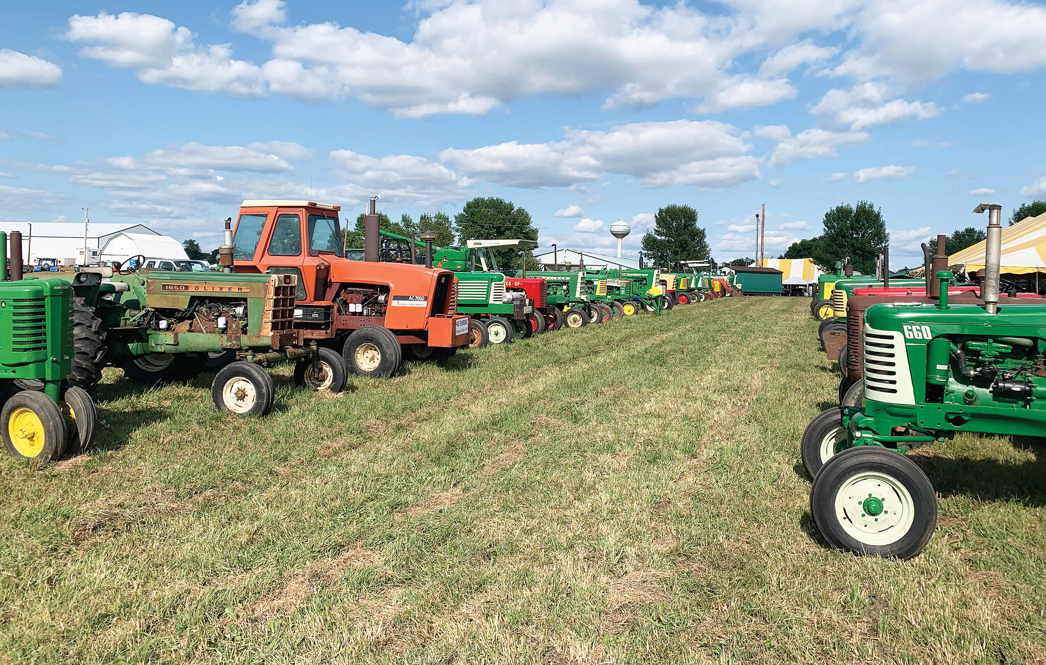 A colorful display of vintage tractors lined Machinery Hill.