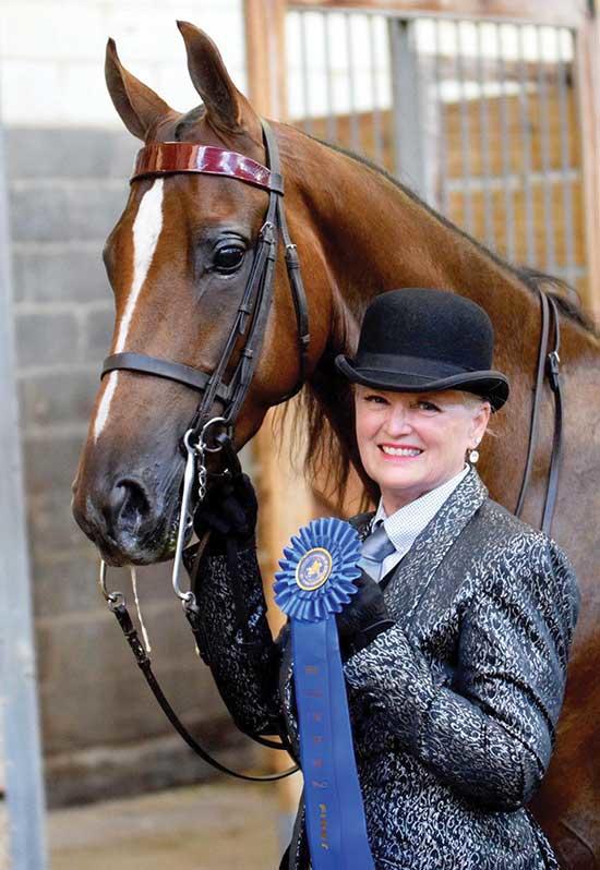 Vicki and “Fancy By Design,” aka George, winning a blue ribbon.