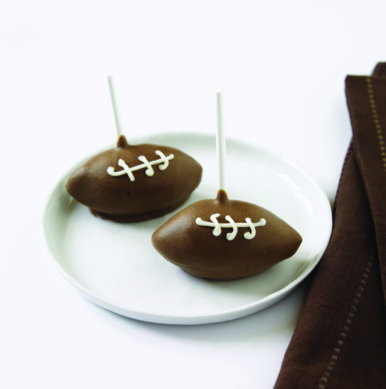 Playoff party hosts can whip up these tasty "Football Cake Pops" from Lines+Angles for young fans.
