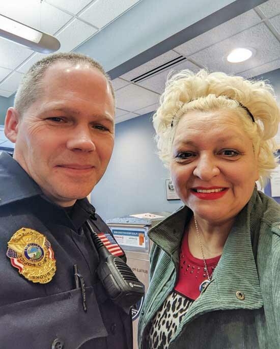 Buffalo Police Chief Pat Budke takes a selfie with Kelly at the Buffalo Police Department.