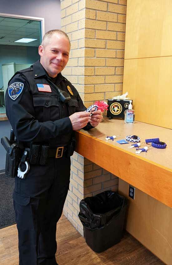 Kelly brought paracord bracelets and “Buffalo Buddies” to the Buffalo Police Department. Chief Budke is pictured holding a paracord bracelet with “Buffalo Buddies” on display.